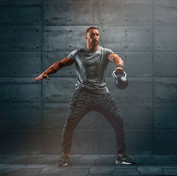 strong muscular men, cross training athlete exercise with kettlebell copy space