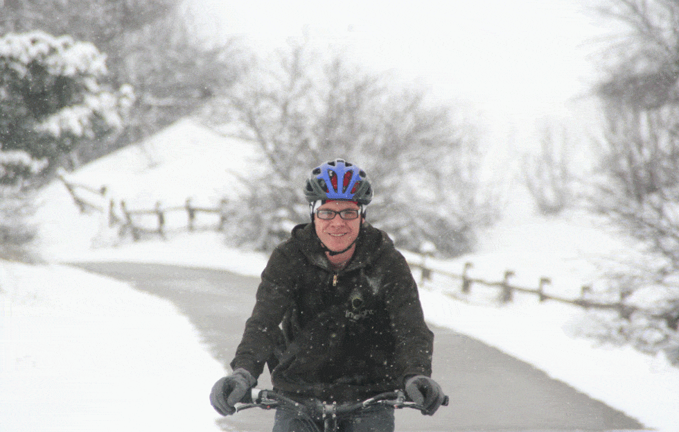Teen bike commuting in the snow