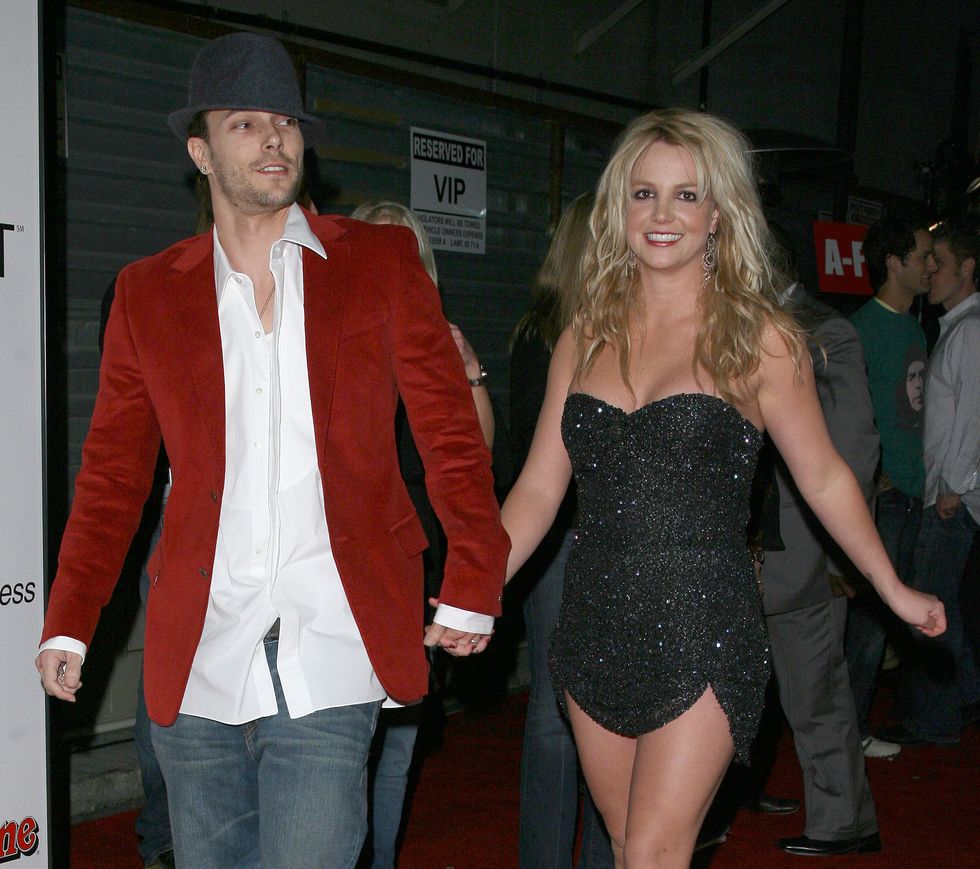 britney spears smiling as she walks and holds hands with kevin federline