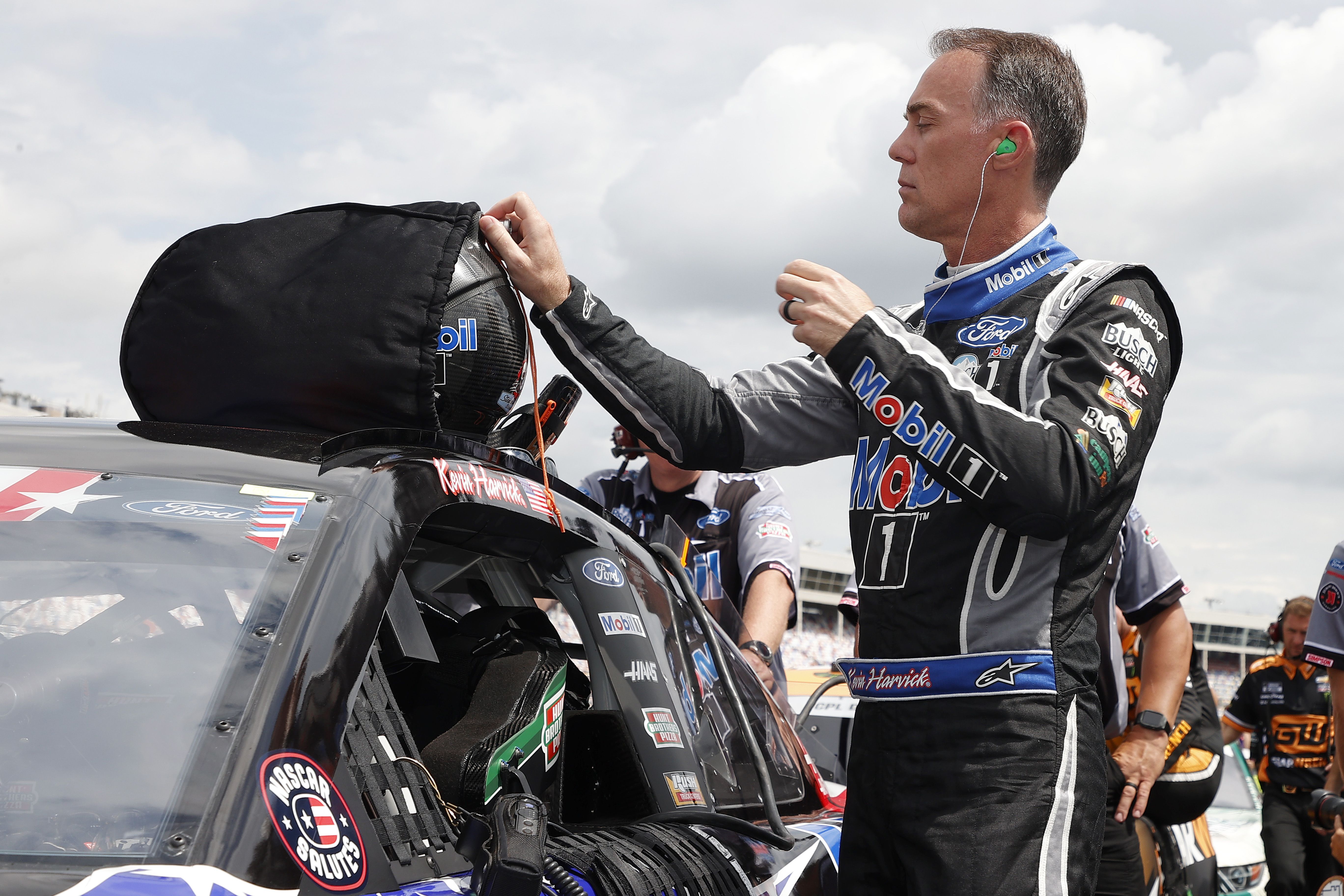 Kevin Harvick, driver of the Mobil 1 Chevrolet, stands on the grid