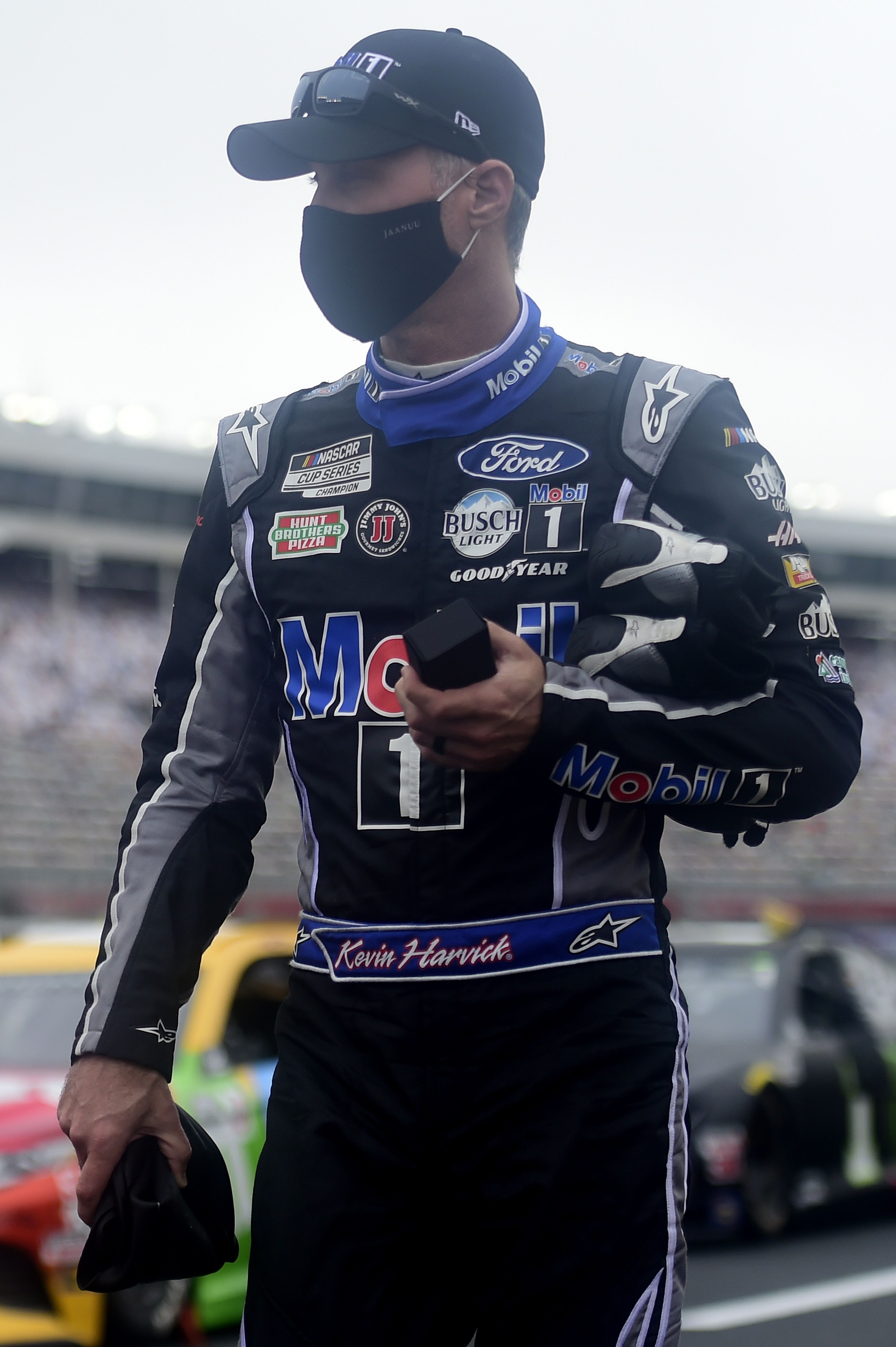 Kevin Harvick, driver of the Mobil 1 Chevrolet, stands on the grid