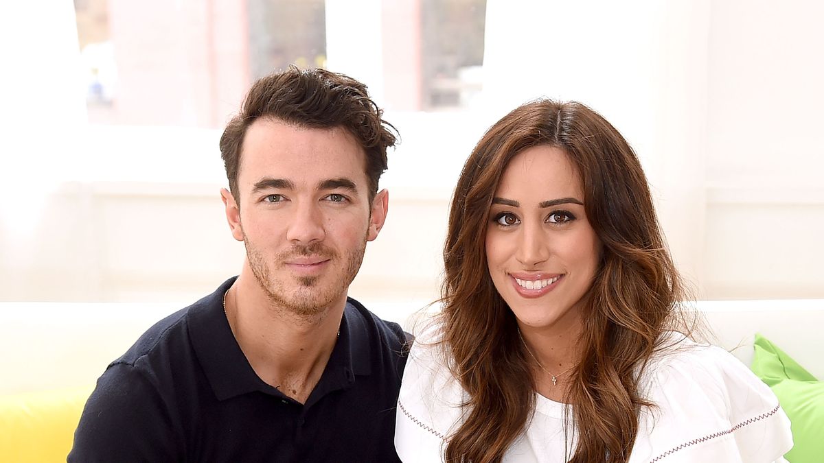 Designer Danielle Jonas and owner Michael Russo attend the