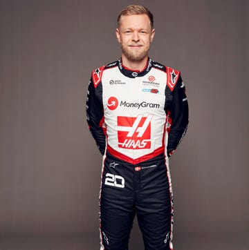 a man wearing a race car uniform