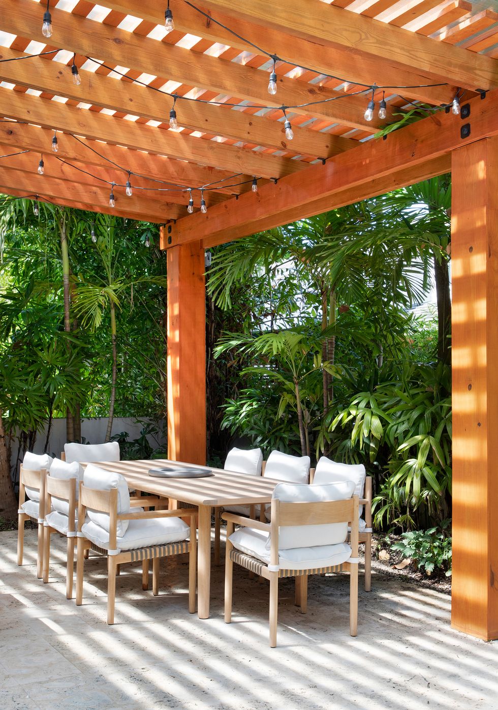 outdoor dining room with wooden pergola