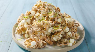 chex, pretzels, and marshmallows in a key lime white chocolate mixture