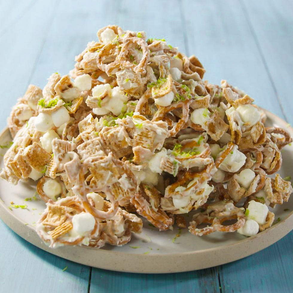 chex, pretzels, and marshmallows in a key lime white chocolate mixture