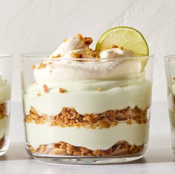 layered key lime pie mousse with whipped cream and a lime