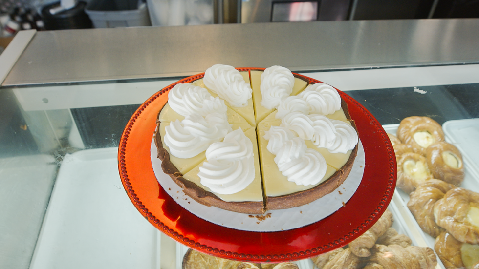 a cake with white frosting