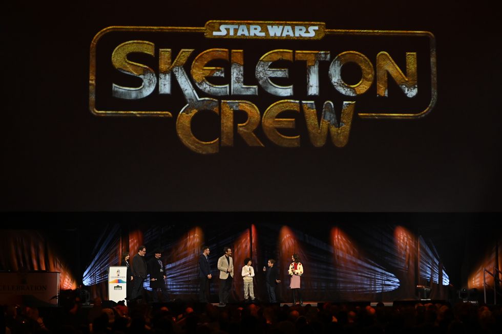 london, england april 07 l r kathleen kennedy, john favreau, dave filoni, presenter ali plumb, jude law, ravi cabot conyers, robert timothy smith and kyrianna kratter onstage during the studio panel for skeleton crew at the star wars celebration 2023 in london at excel on april 07, 2023 in london, england photo by kate greengetty images for disney