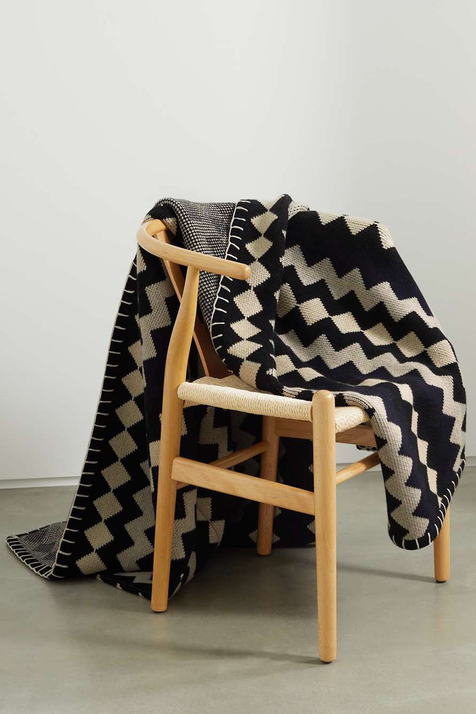 a chair with a blanket on it