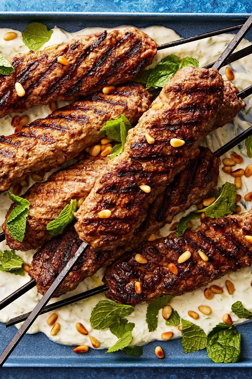 Kibbe-flavored grilled lamb skewers Kibbeh's Spiced Lamb Skewers with Tzatziki Sauce