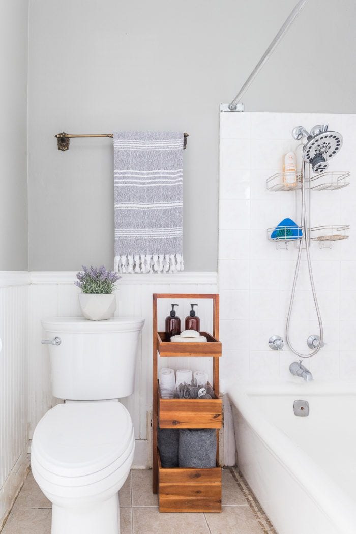 a bathroom with a toilet and bathtub