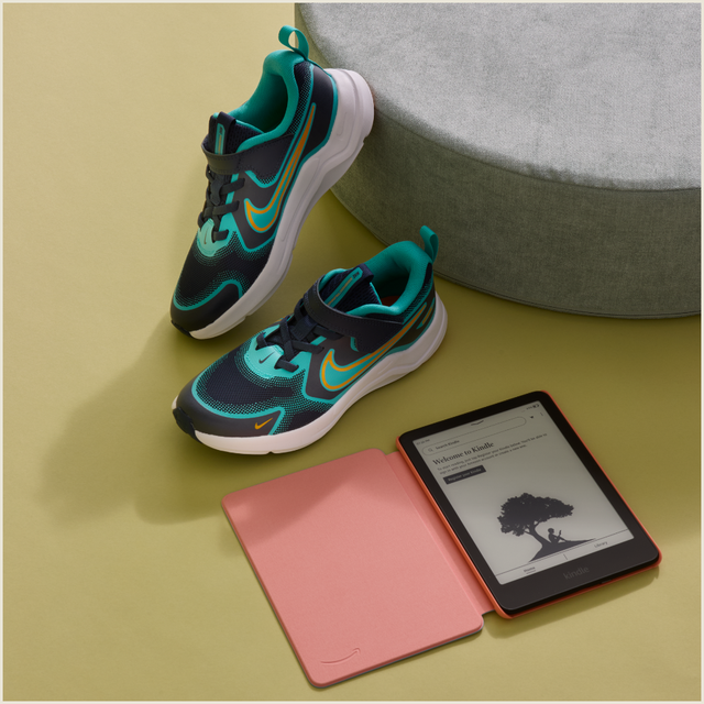 sport shoes and a kindle ereader with a pink cover on a yellow background