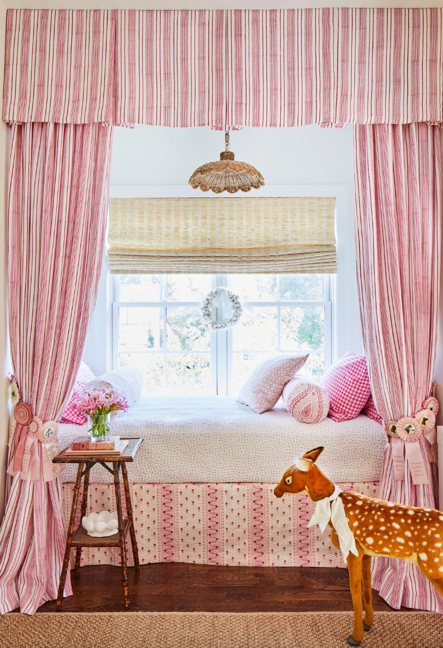 pink girls bedroom nook with curtains