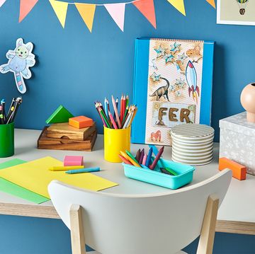 kids desk with art supplies and toys