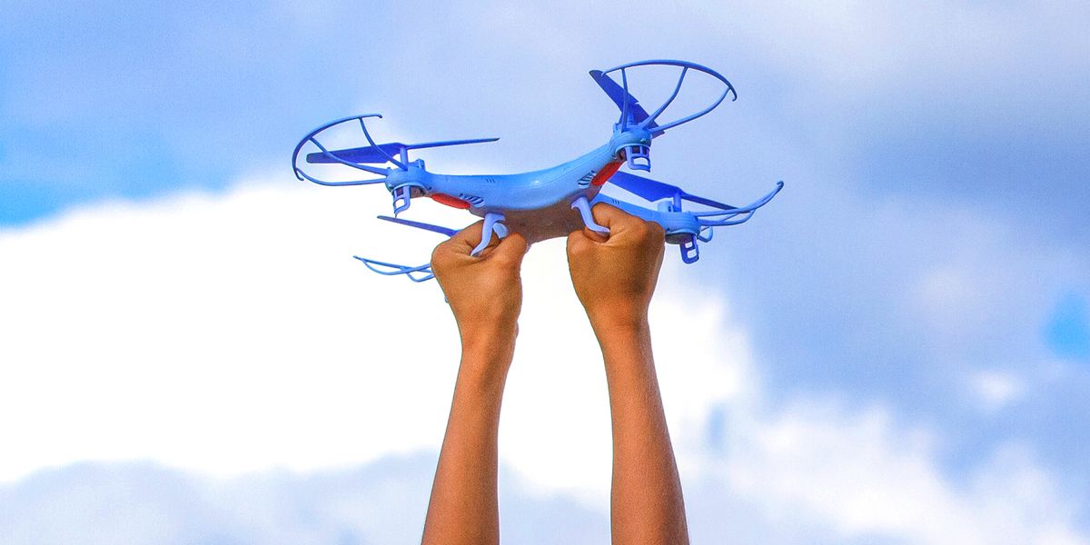 kid's hands holding drone toy