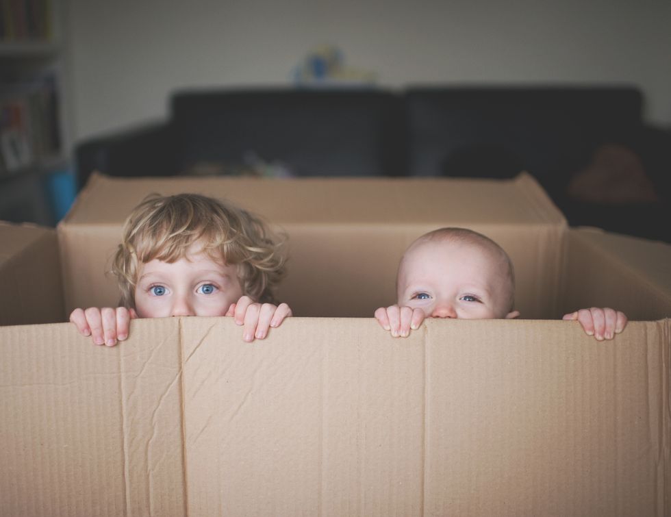 kids in a cardboard box