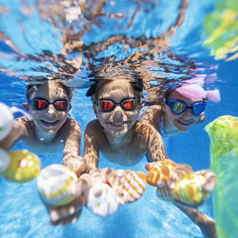 kids doing an underwater easter egg hunt in a pool