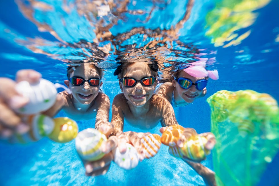 kids doing an underwater easter egg hunt in a pool