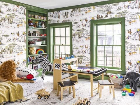 kids room with wallpaper and green paint