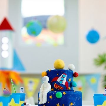 kids space theme birthday party with cake