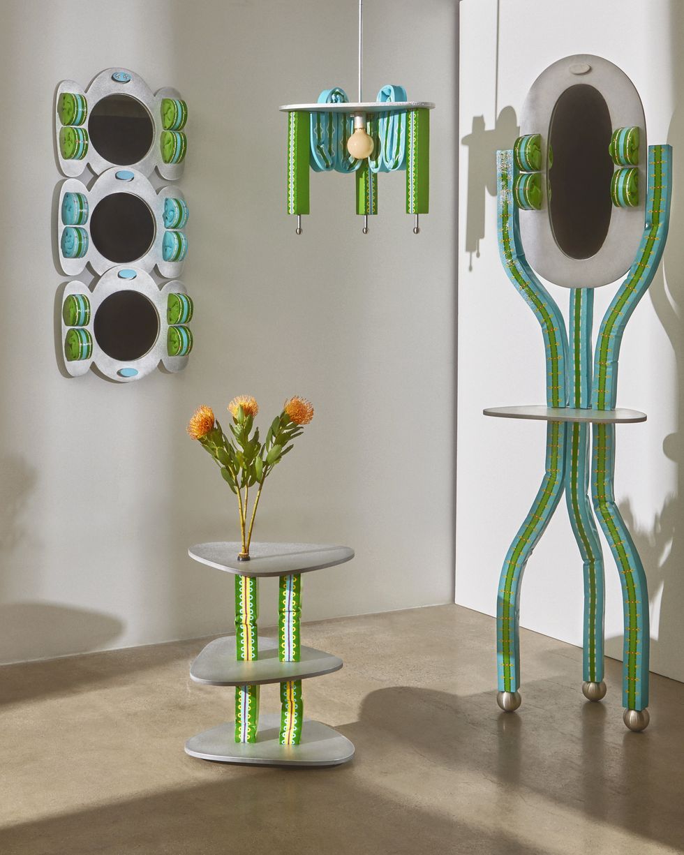 a green blue and aluminum mirror, vanity and table