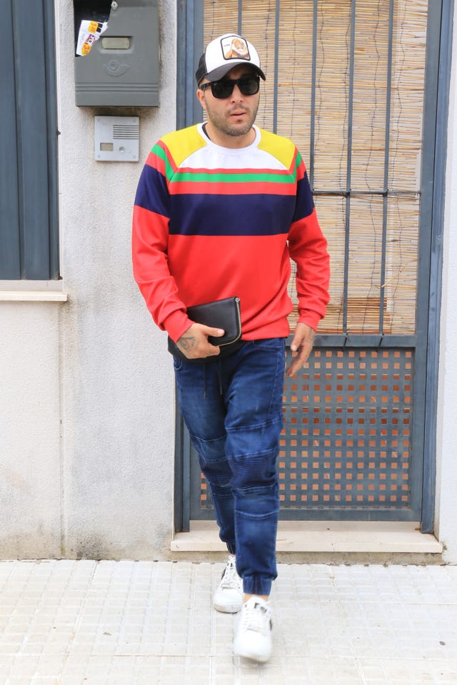 Street fashion, Clothing, Red, Yellow, Jeans, Standing, Jacket, Workwear, Fashion, High-visibility clothing, 