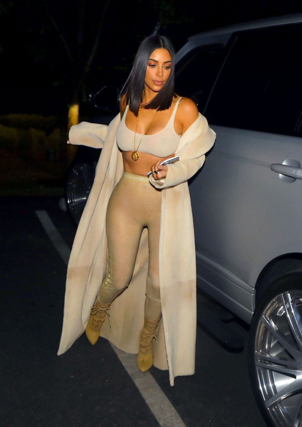 Kim Kardashian Elevates Hosiery in a Camo Bralette, Silky Tights