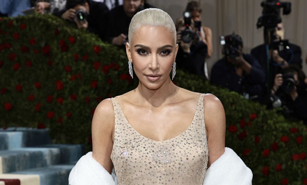 Kim Kardashian Sparkles With Balenciaga Bag and Catsuit at 818 Launch – WWD