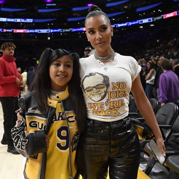 kim kardashian and north west at the los angeles lakers game
