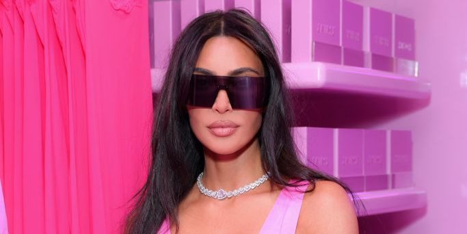 Kim Kardashian Poses with a Retro Car in a Trendy Brown Bikini