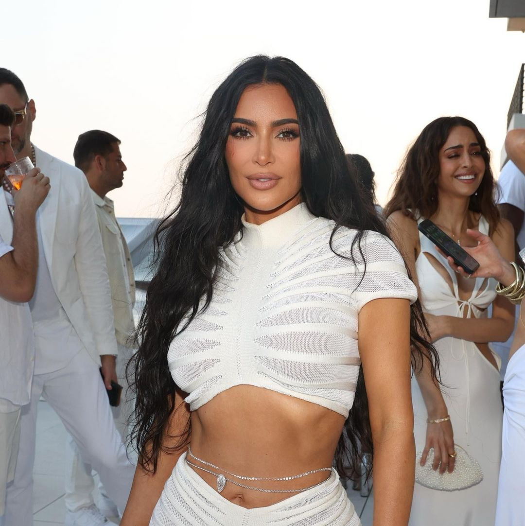 Kim Kardashian wears a huge diamond belly chain to white party