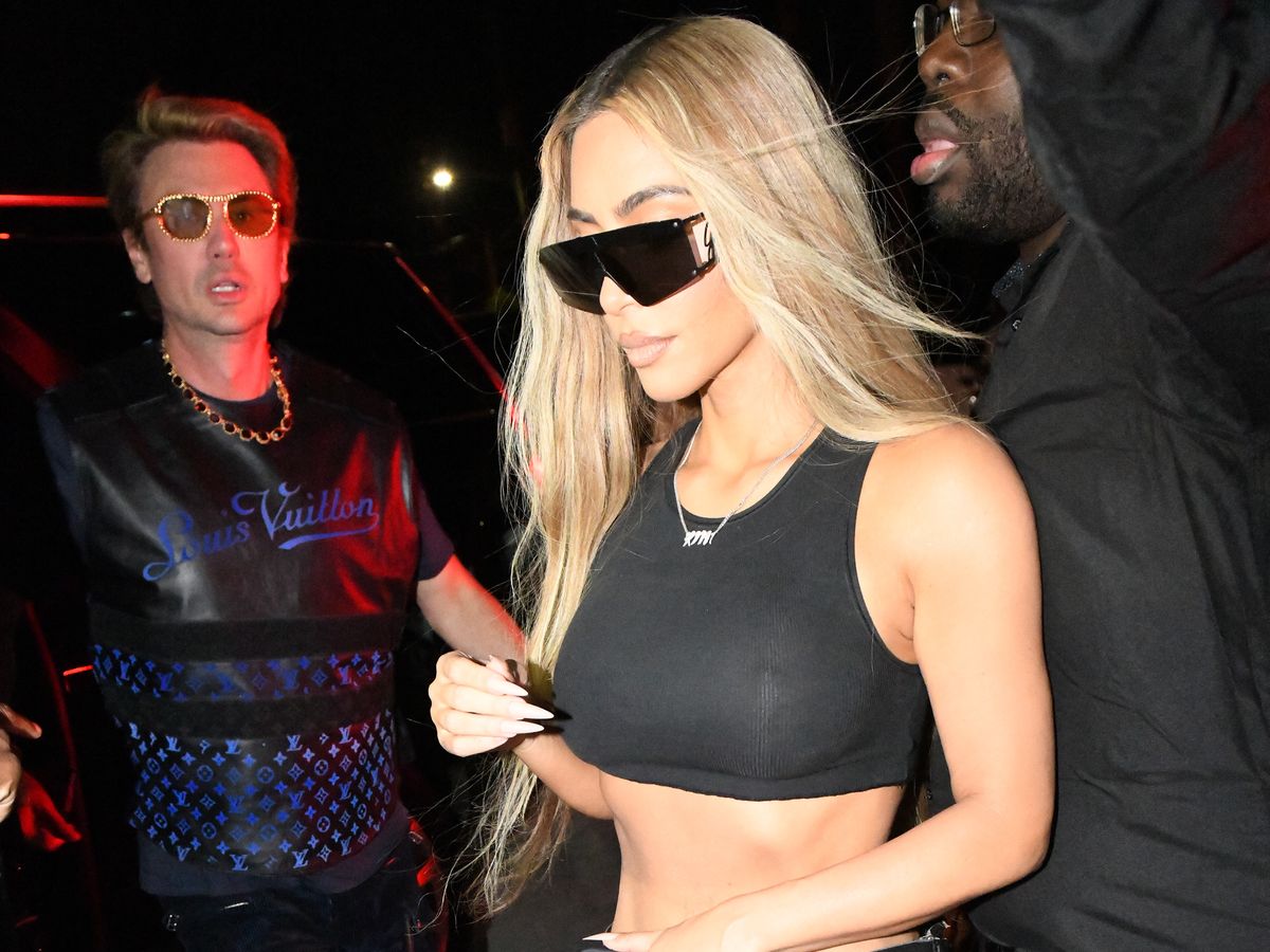 Kim Kardashian Wears Tight Leather Pants and Cropped Tank to Miami Club