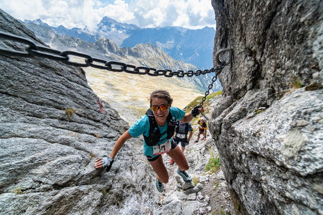 a man climbing a rock wall