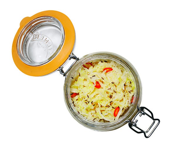glass storage jar filled with kimchi