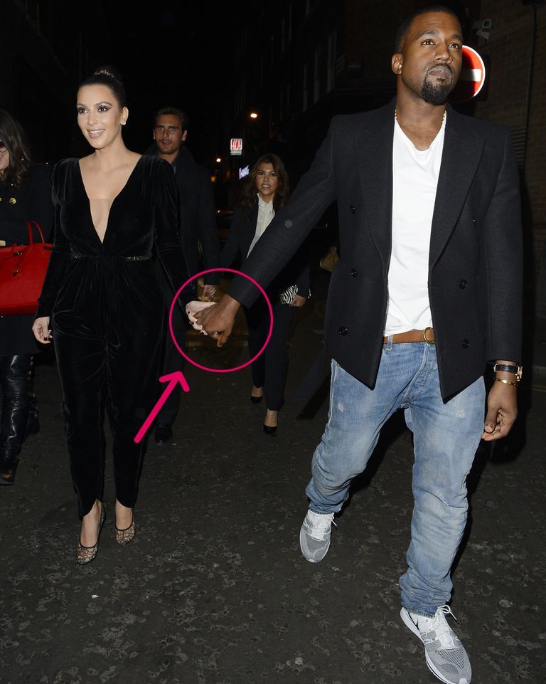 Kanye and Kim holding hands