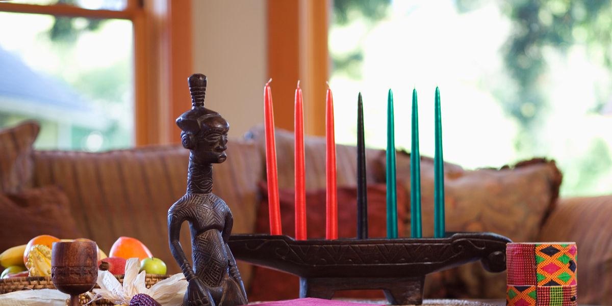 kinara with kwanzaa candles on coffee table