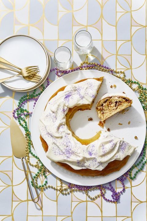 mardi gras king cake with purple sprinkles and white icing