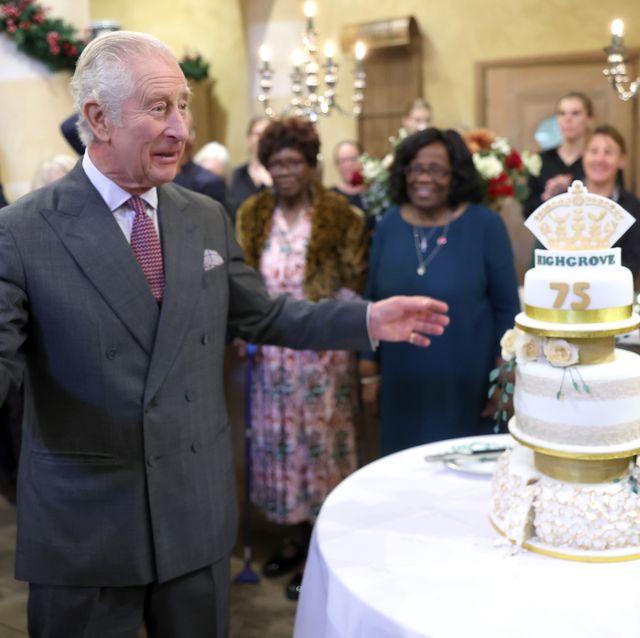 king charles iii stands with 75th birthday cake