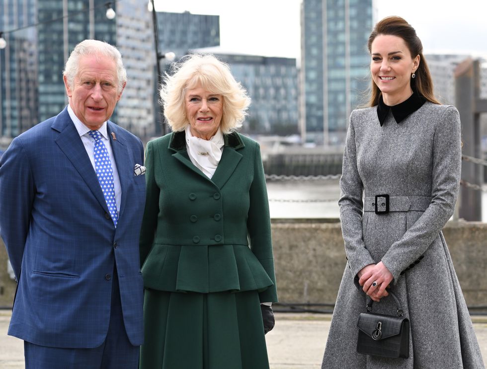 charles, camilla and kate stand together at a royal engagement