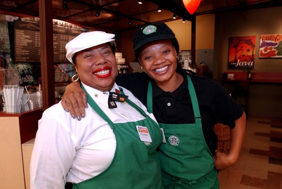 King Soopers employee Regenia Underwood, left and her coworker Kim Bishop, right, work the new Starbucks counter at the recently remodeled 9th and Corona location. Underwood has worked at Kings for 13 years. Denver Post photo by Karl Gehring.
