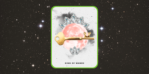 the tarot card the king of wands over a starry night sky
