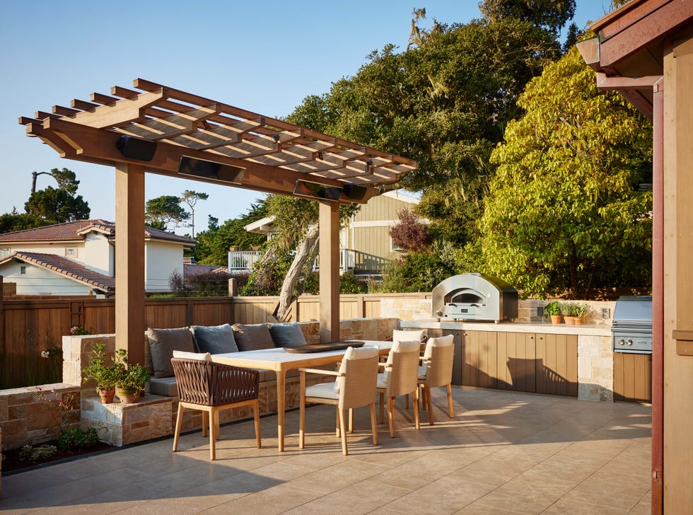 casa en la playa con jardín y golf: comedor y cocina exterior