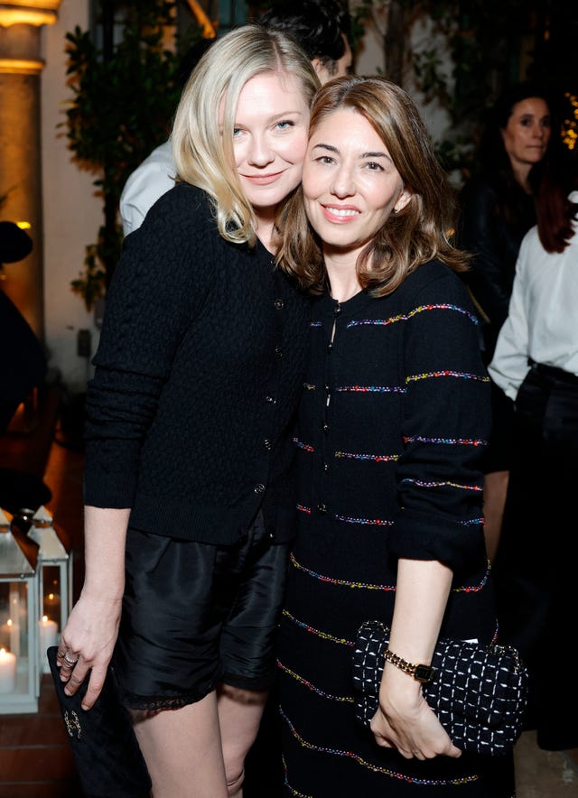 Kirsten Dunst recommended Cailee Spaeny for the Priscilla movie kirsten dunst and sofia coppola embracing for a photo at a dinner event