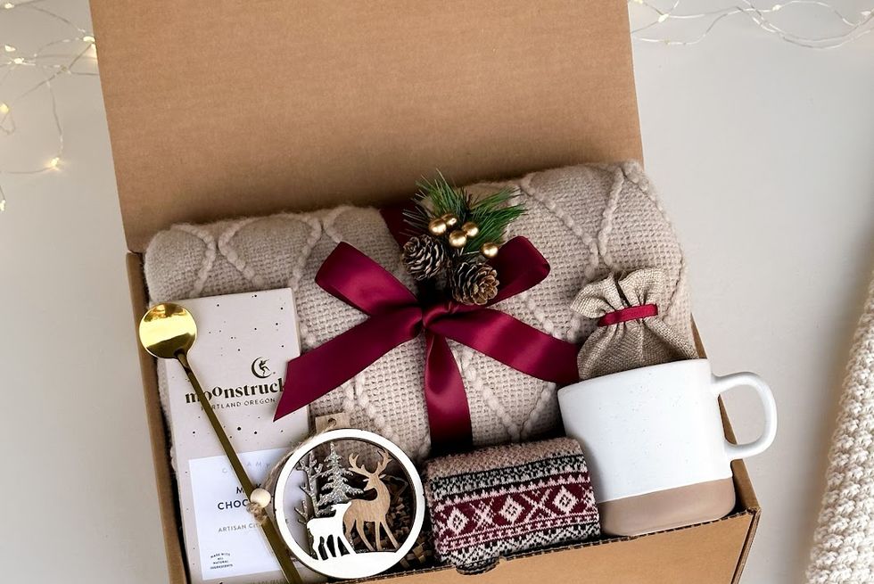 a box with a gift box and a clock