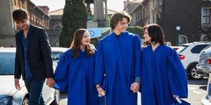 cast of the kissing booth 2 in a scene from the film in graduation attire