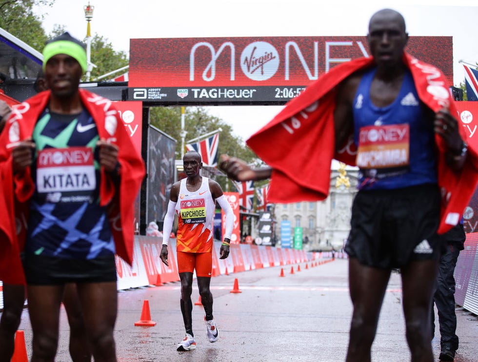 london, england   october 04 eliud kipchoge of kenya reacts as he crosses the line as first place shura kitata of ethiopia and second place vincent kipchumba of kenya celebrate following the elite men’s race during the 2020 virgin money london marathon around st jamess park on october 04, 2020 in london, england the 40th race will take place on a closed loop circuit around st james’s park in central london  photo by richard heathcotegetty images