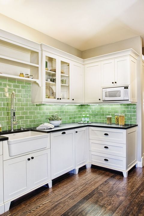 kitchen backsplash ideas, glossy green tiles in the kitchen with white cabinets and wood flooring