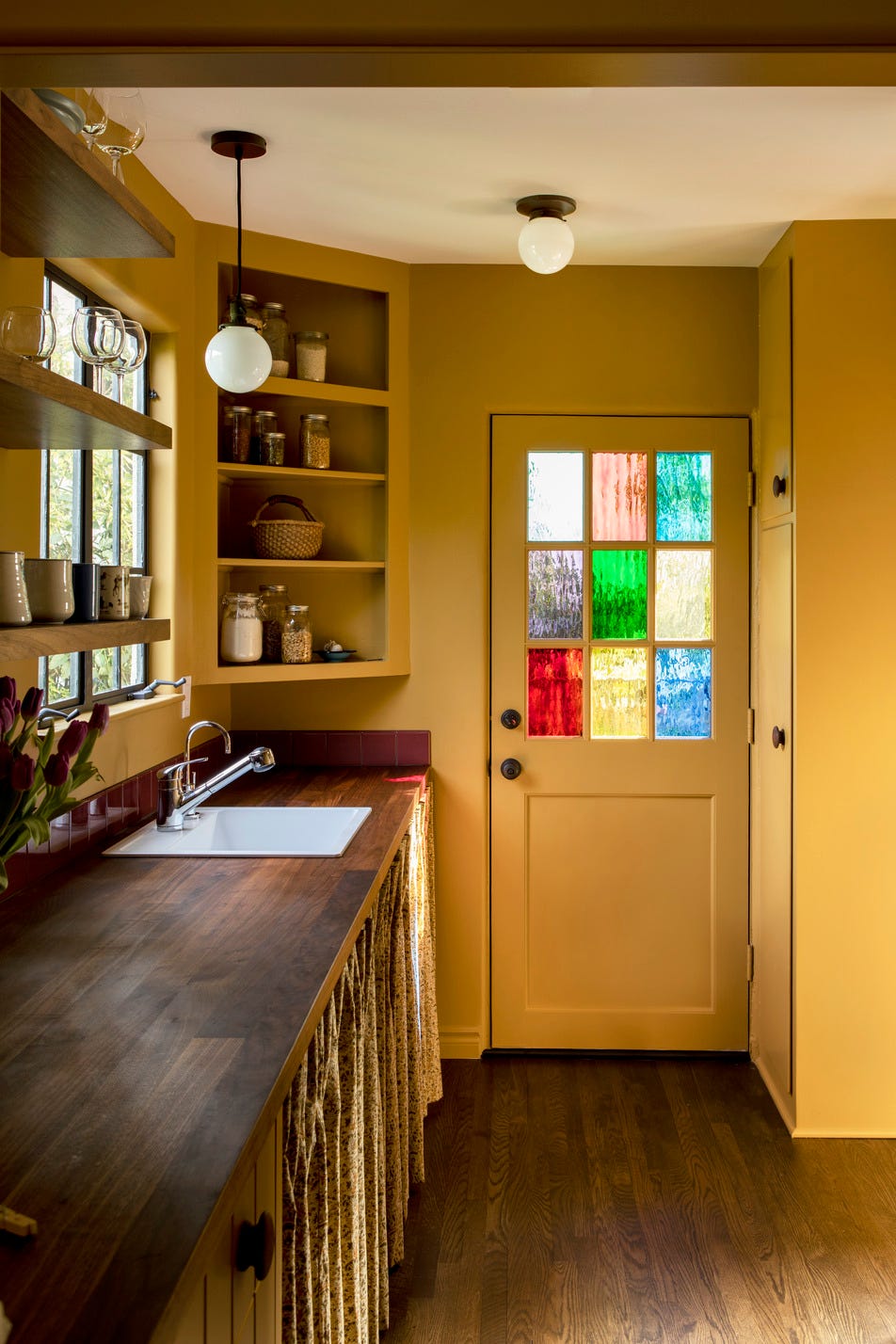 kitchen door with stained glass window home by reath design