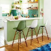 green kitchen with tile backsplash